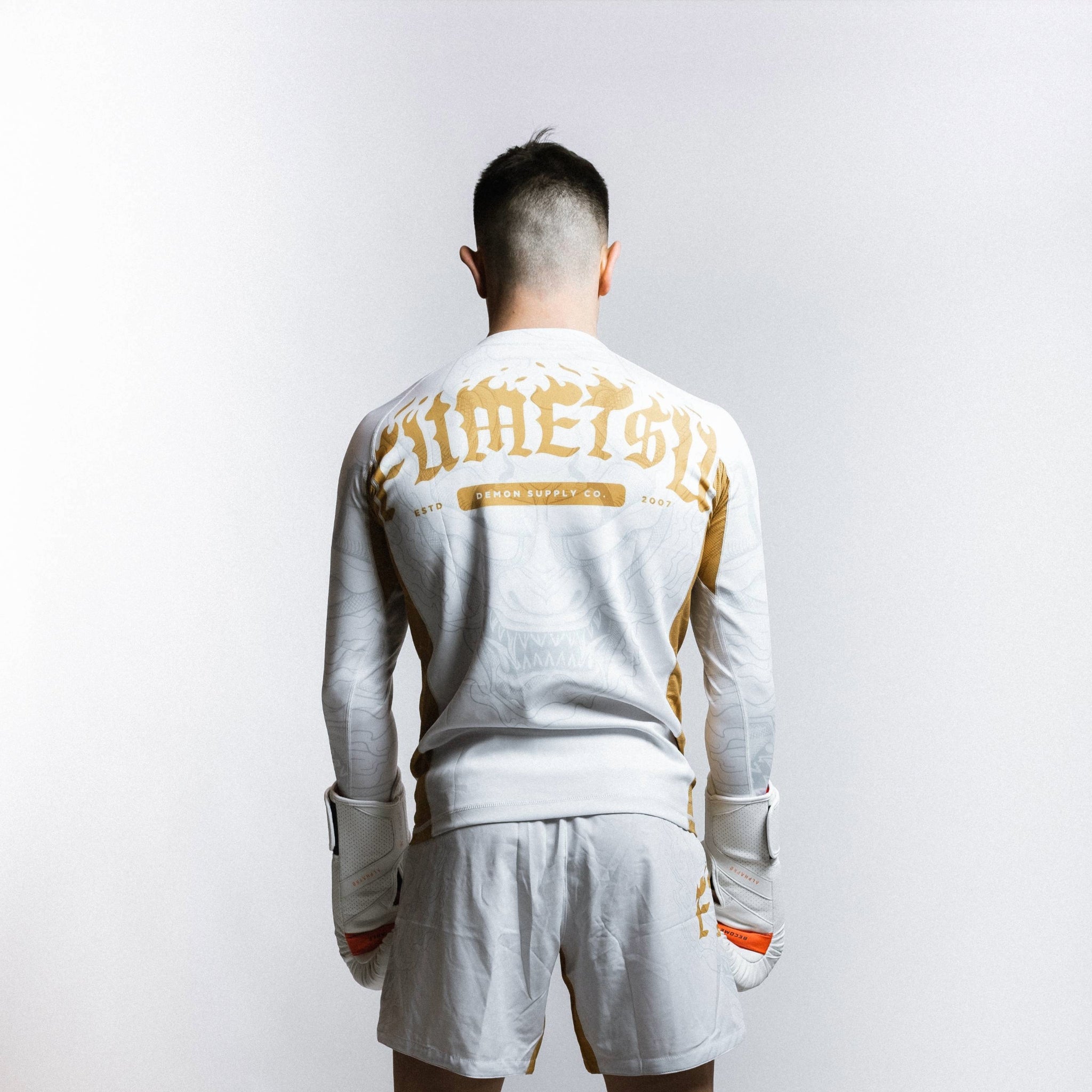 Oni Long Sleeve Rash Guard White/Gold/Grey